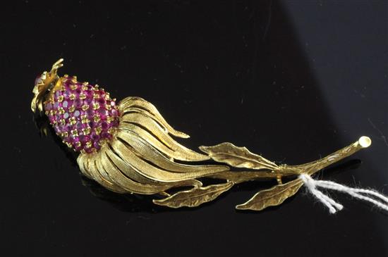 An 18ct gold and ruby trembleuse brooch modelled as an exotic fruit, 3in.